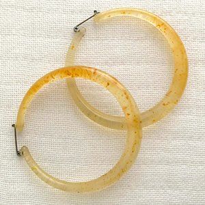 Large 2.5" vintage lucite yellow w/ fleck opaque hoop earrings